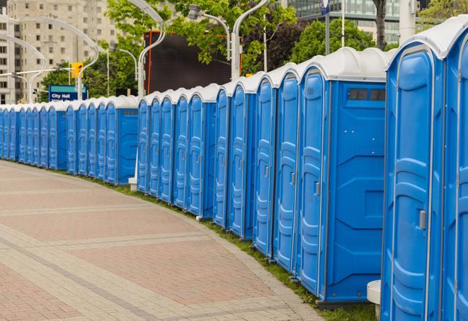 hygienic portable restrooms lined up at a beach party, ensuring guests have access to the necessary facilities while enjoying the sun and sand in Irving, TX